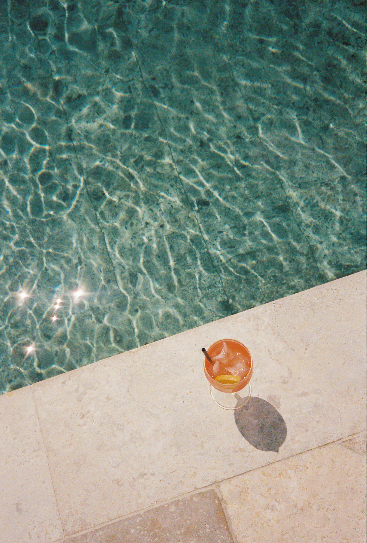 image of aperol spritz by the pool